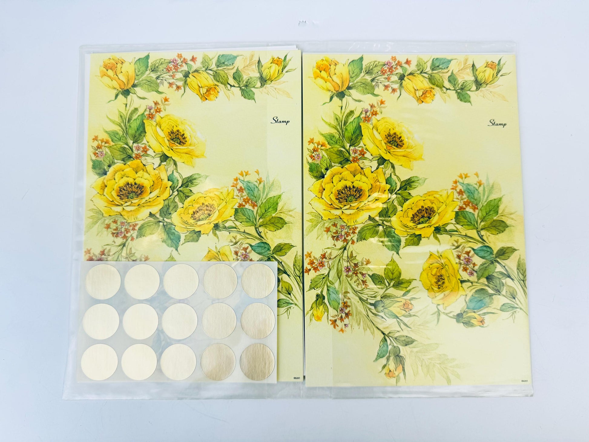 Floral design notebook with stickers on a light blue background
