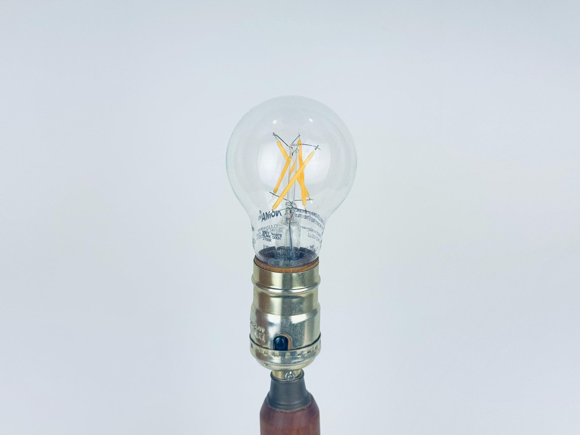 Clear light bulb on a white background