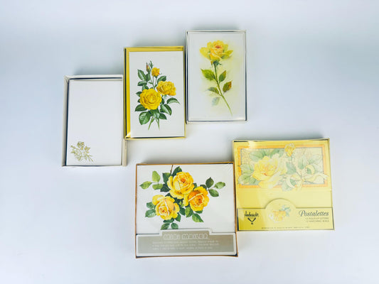 Set of decorative boxes with floral designs on a light gray background
