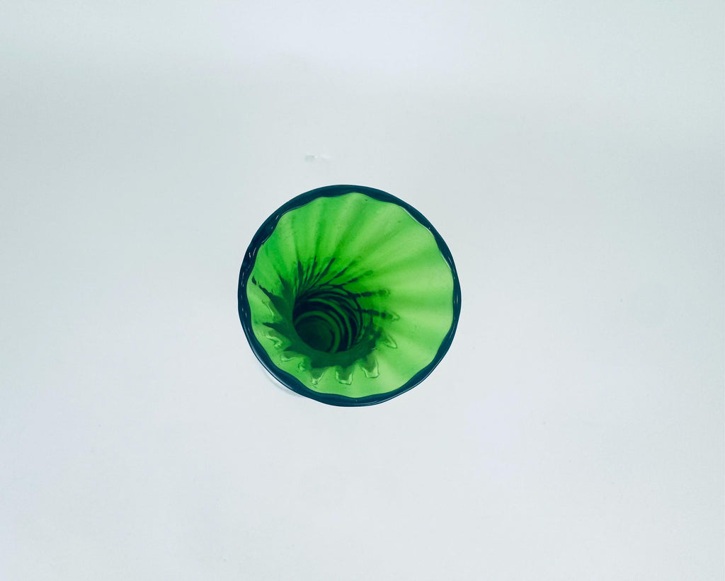 Green glass vase on a white background