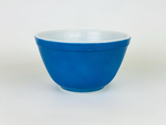 Blue glass bowl on a white background