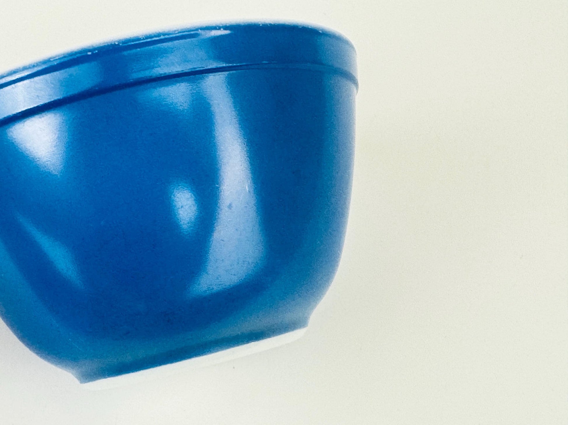 Blue glass bowl on a white background