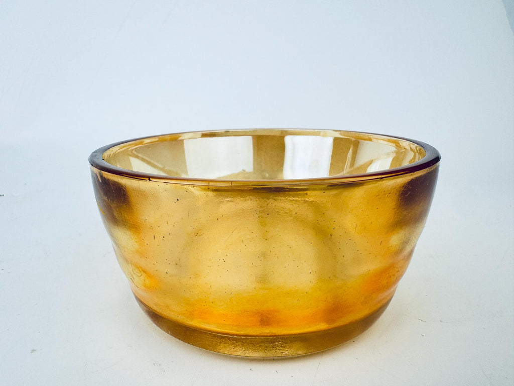 Amber glass bowl on a white background