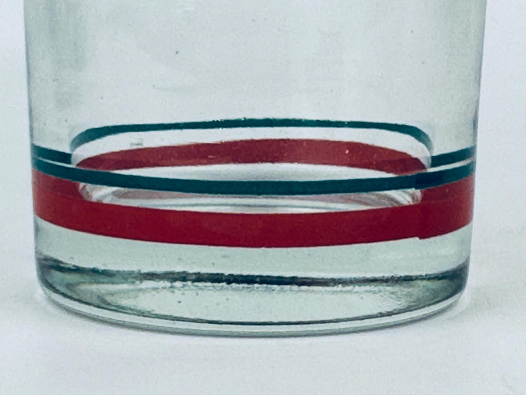 Clear glass with red and blue stripes on a white background