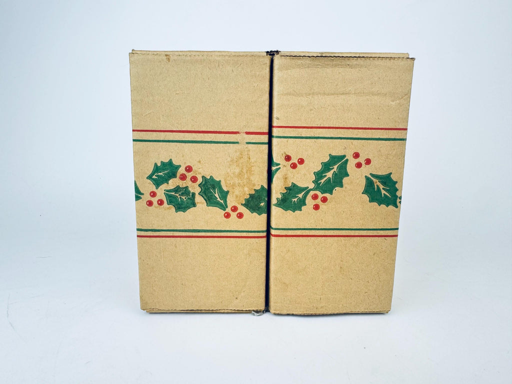 Cardboard box with holly design on a white background