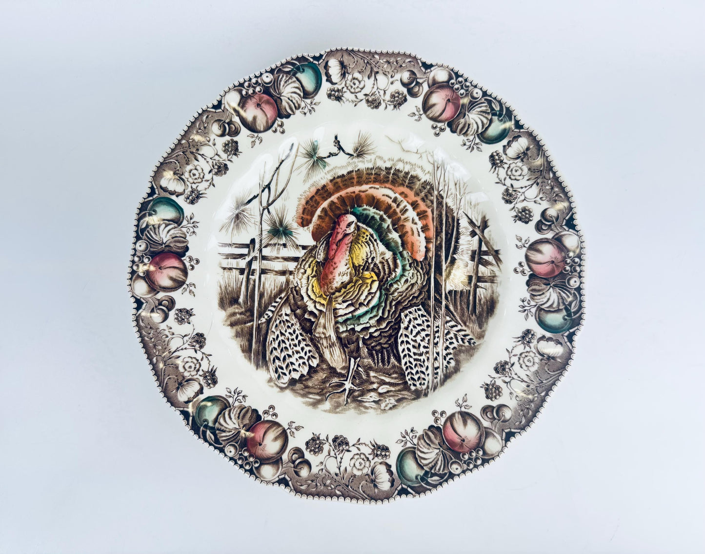 Decorative plate with a turkey design on a light brown background