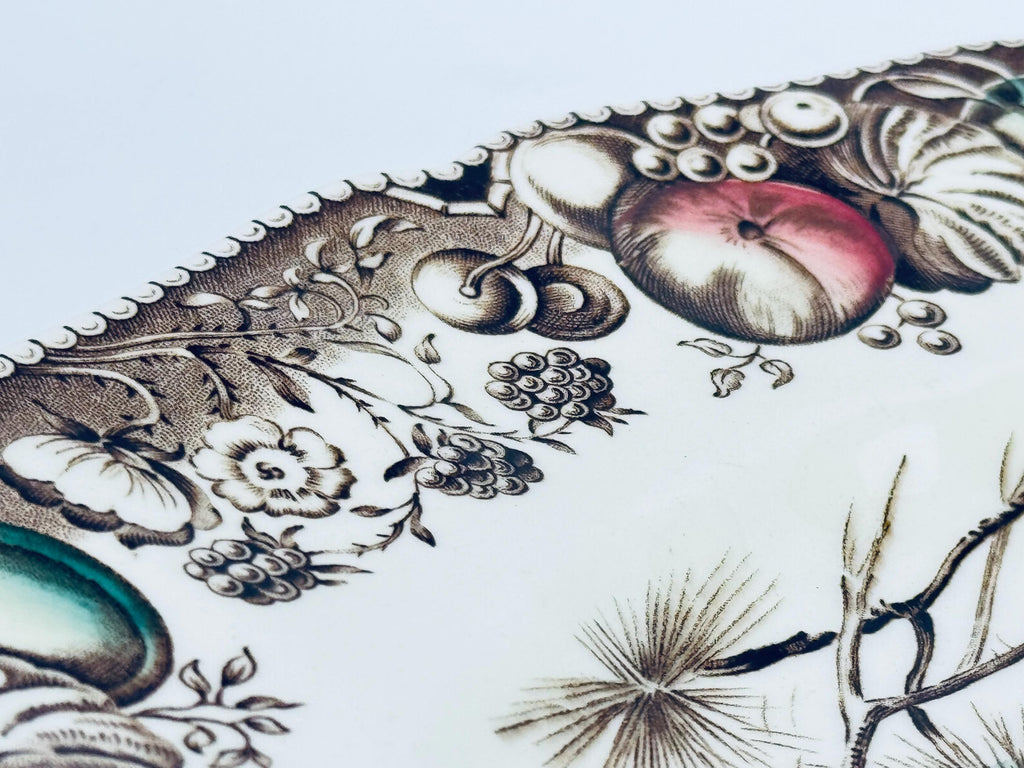 Decorative plate with intricate floral and botanical design on a white background