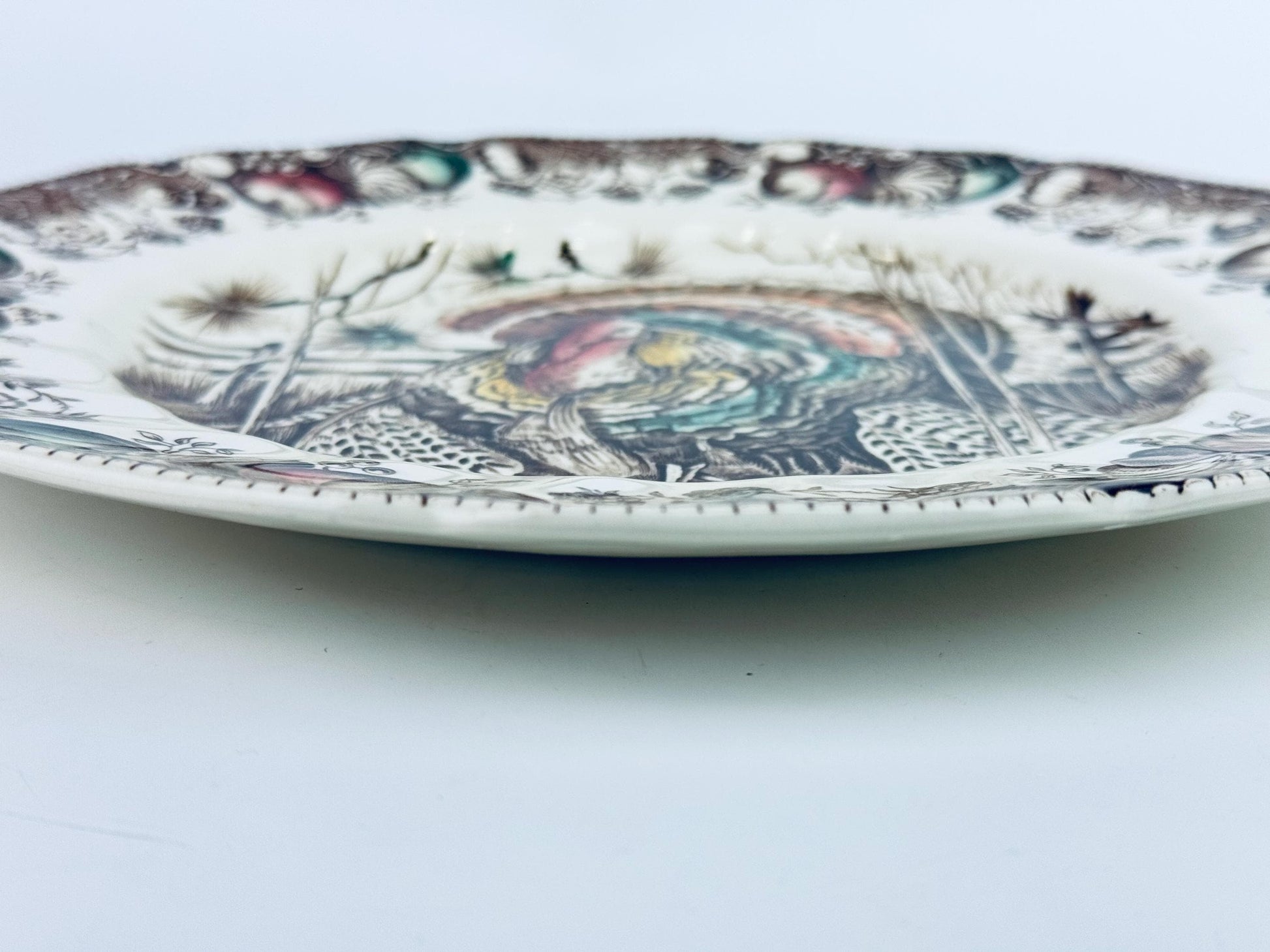 Decorative plate with intricate patterns on a white background
