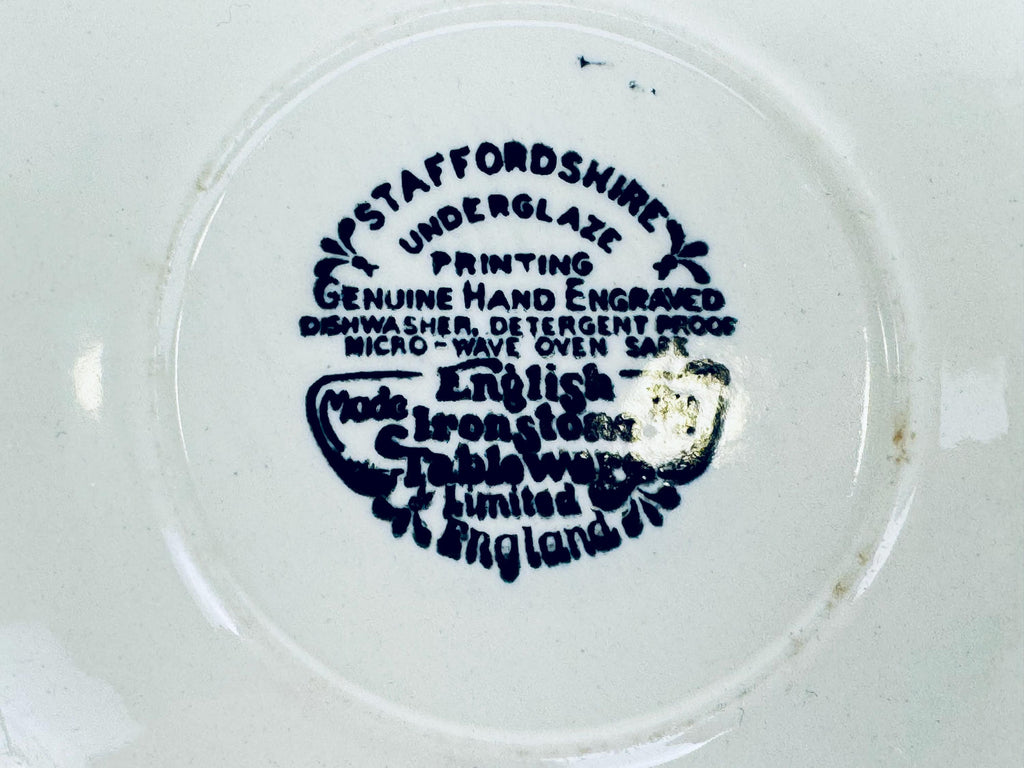 Ceramic plate with 'Staffordshire' branding and text on a white background