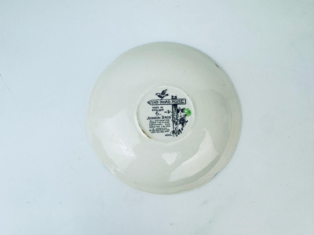 White ceramic bowl with a label on a light gray background