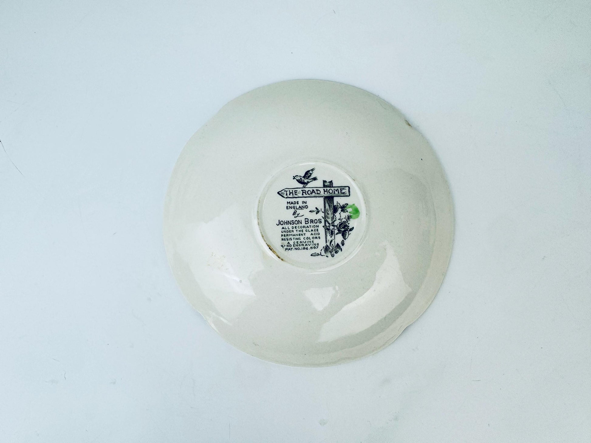 White ceramic bowl with a label on a light gray background