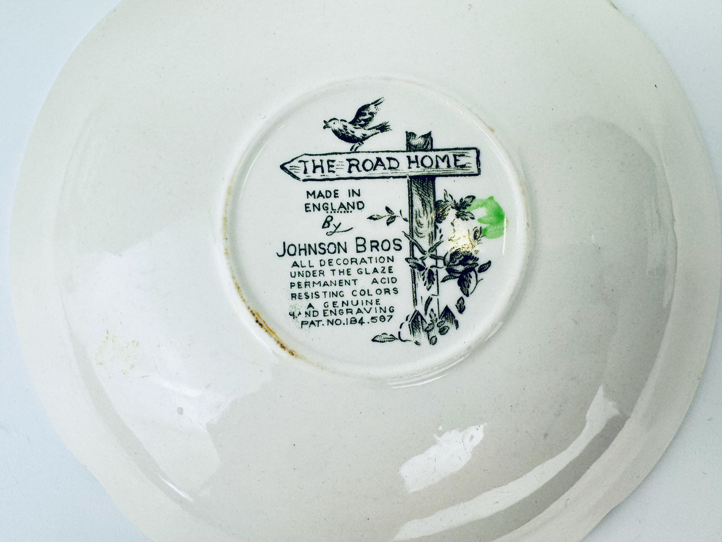 Johnson Bros decorative plate with a label on a white background