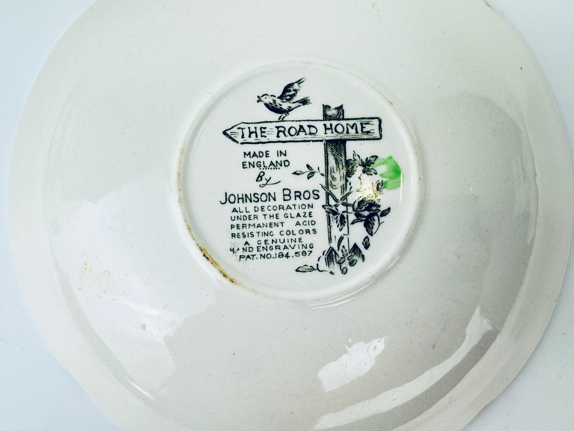 Johnson Bros decorative plate with a label on a white background