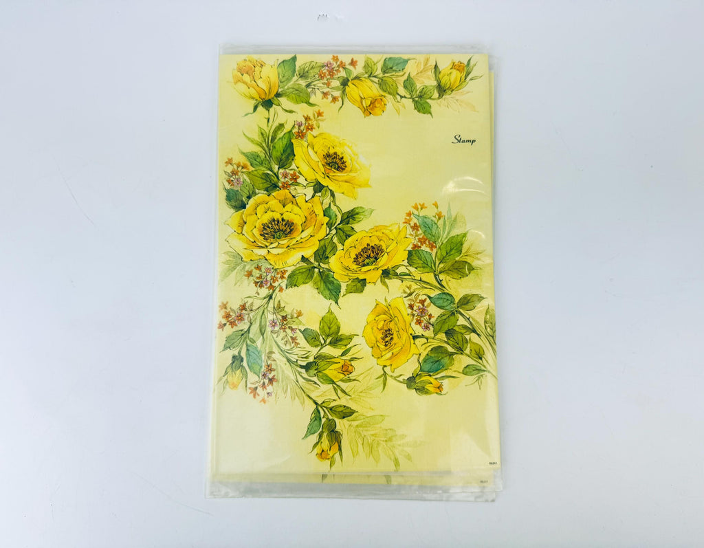 Floral design on a yellow background with 'Stamp' writing.