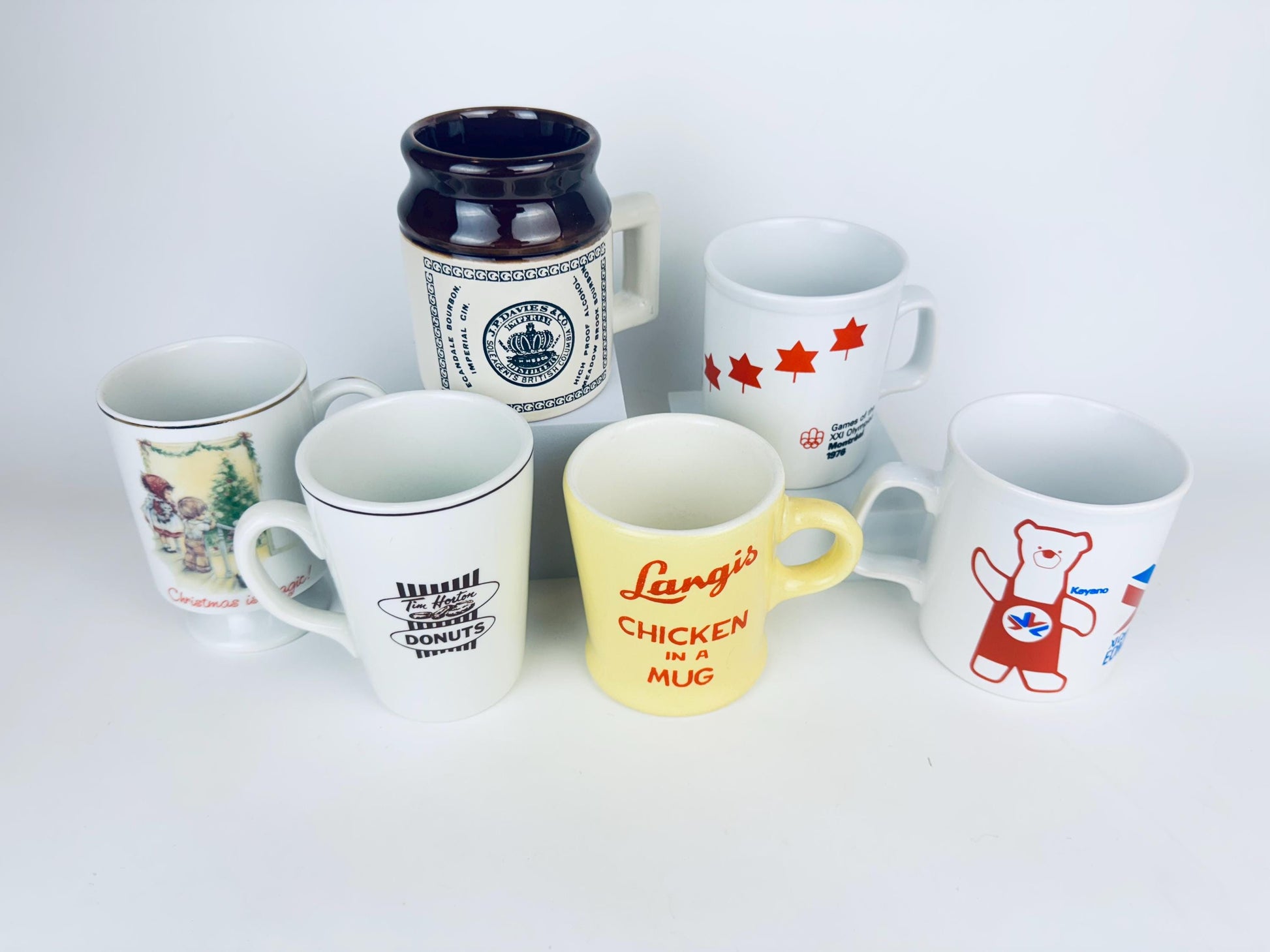 Collection of various mugs with different designs and text on a white background