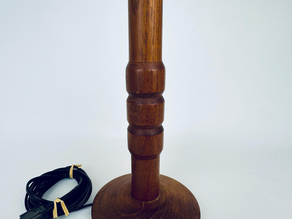 Wooden lamp with a cord on a white background