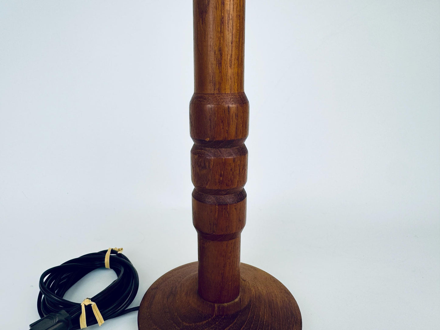 Wooden lamp with a cord on a white background