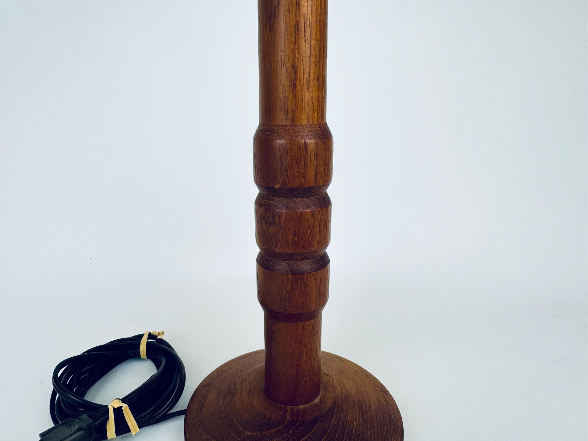 Wooden lamp with a cord on a white background