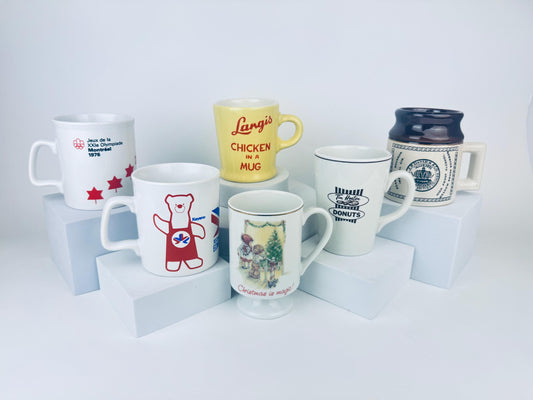 Collection of various mugs with different designs and text on a white background