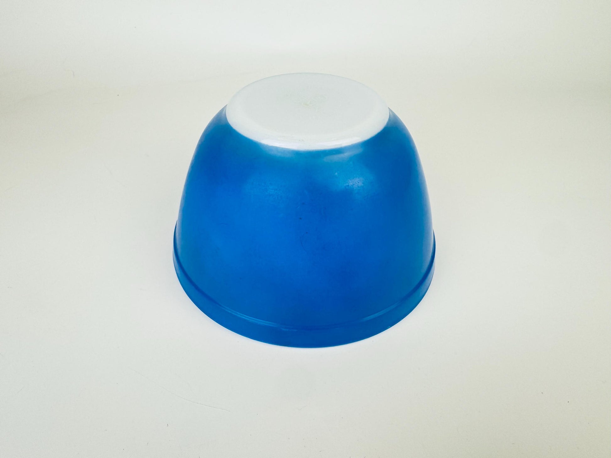 Blue glass bowl on a white background