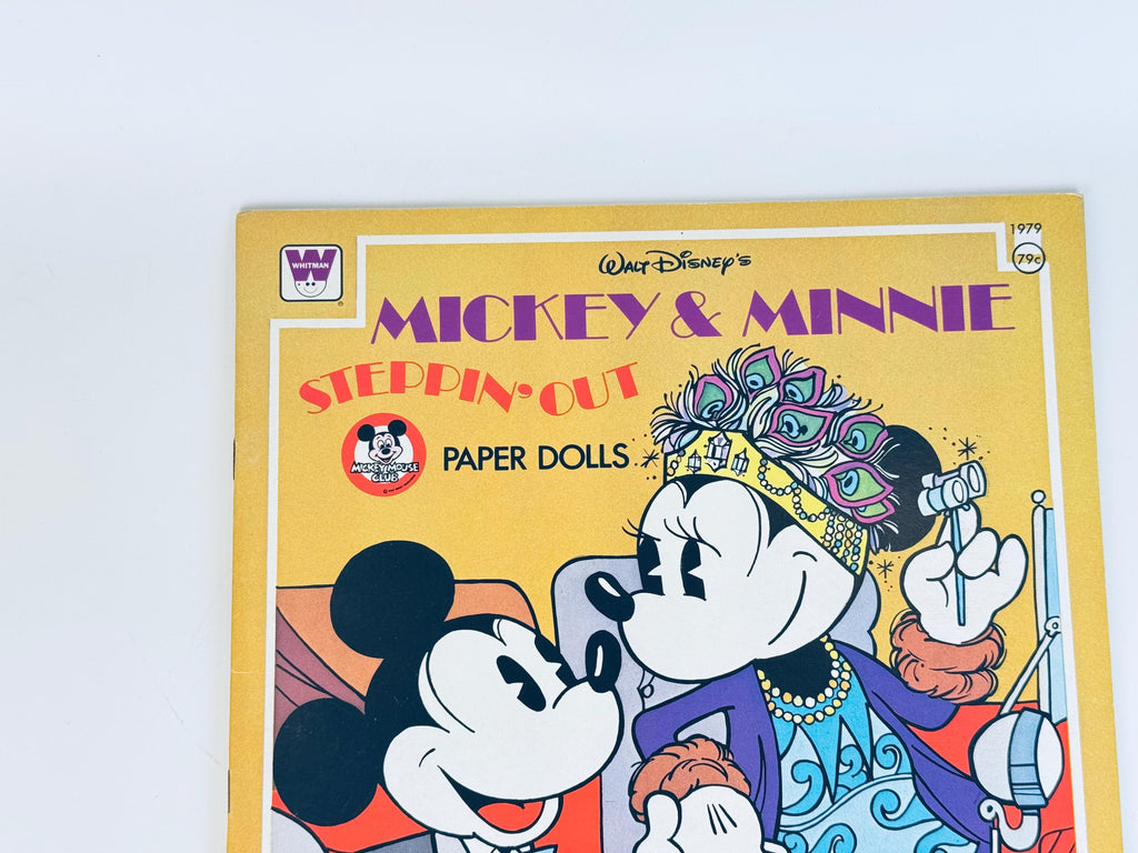 Close-up of book cover showing Mickey and Minnie Mouse illustration with bold title text