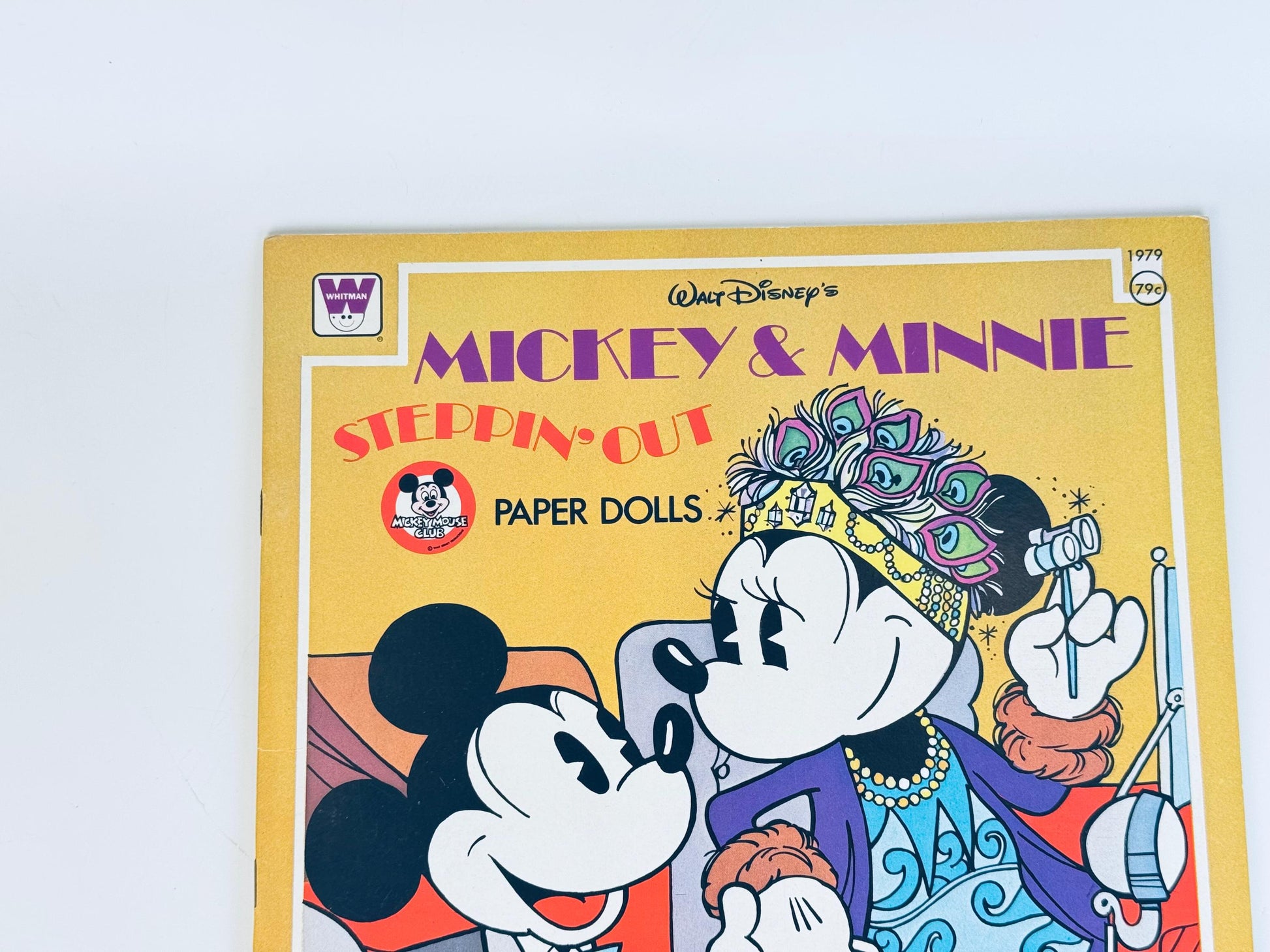 Close-up of book cover showing Mickey and Minnie Mouse illustration with bold title text