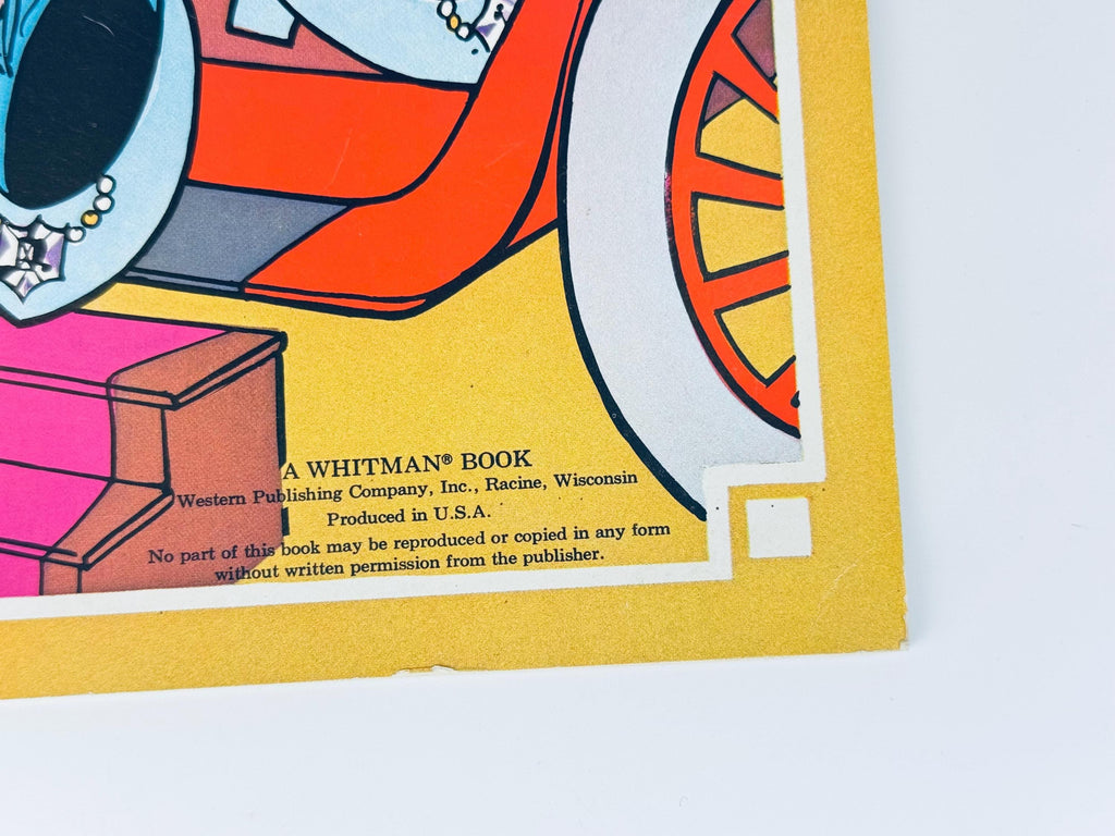 Close-up of lower corner of cover showing illustration details and edges of paper