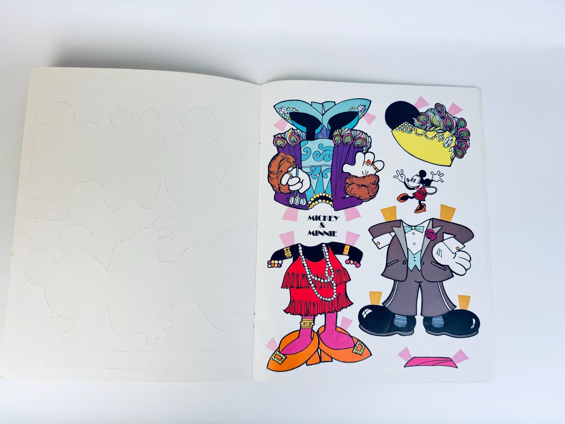 Interior sheet of full-colour paper doll clothing and accessories for Mickey and Minnie