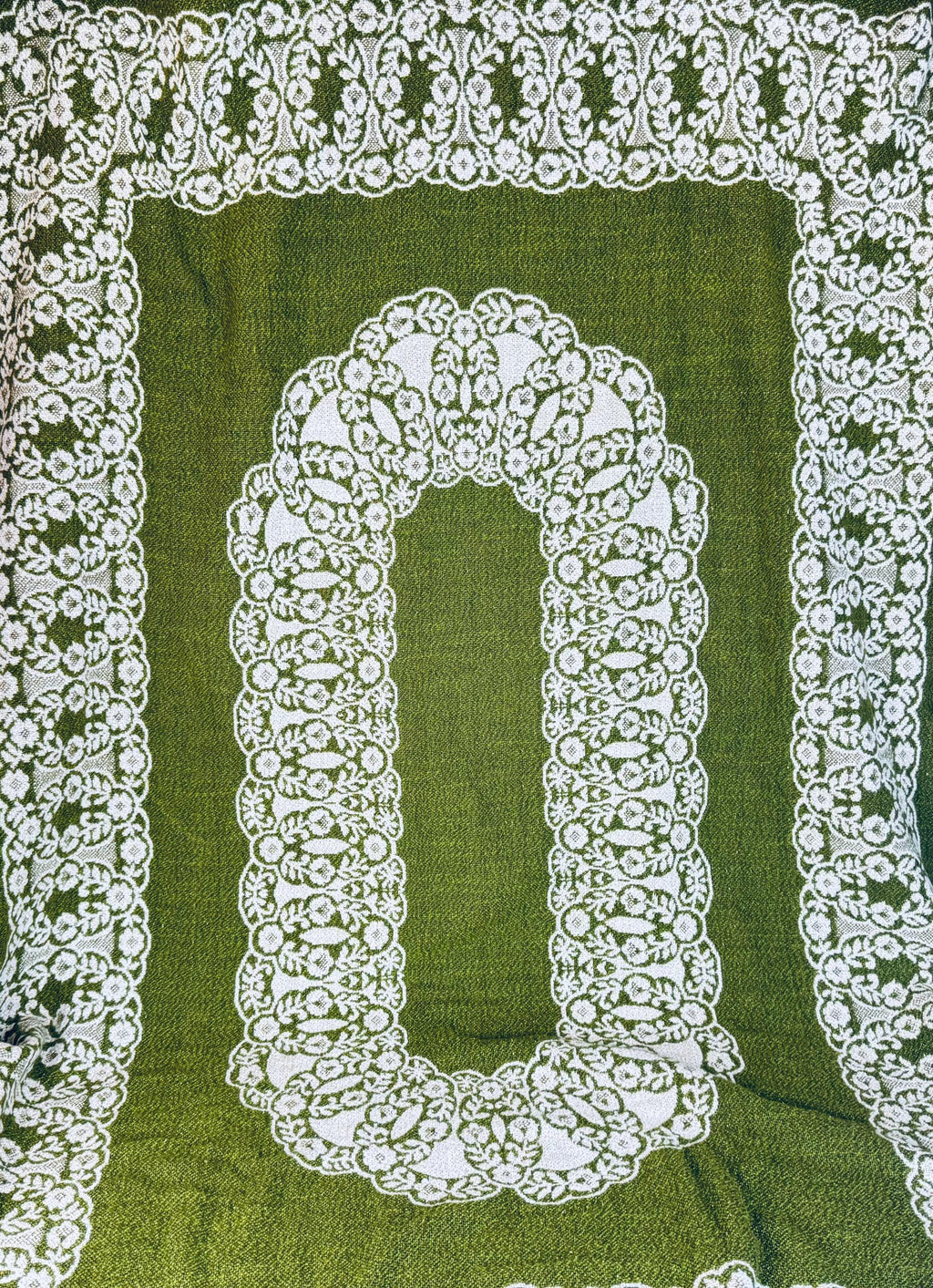 Reversible tablecloth corner flipped to reveal reverse side of woven pattern