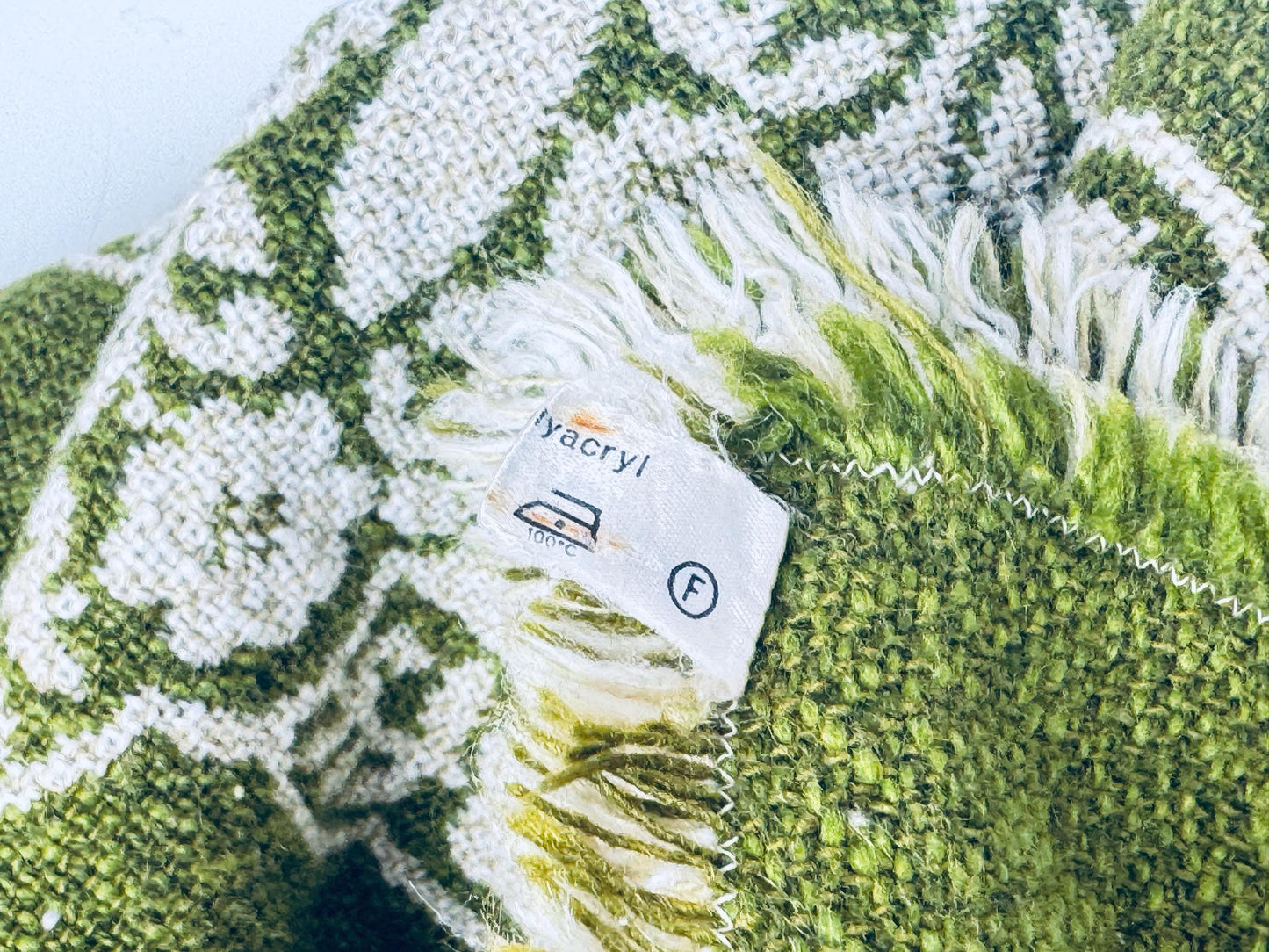 Label close-up showing acrylic fibre content and laundering care instructions