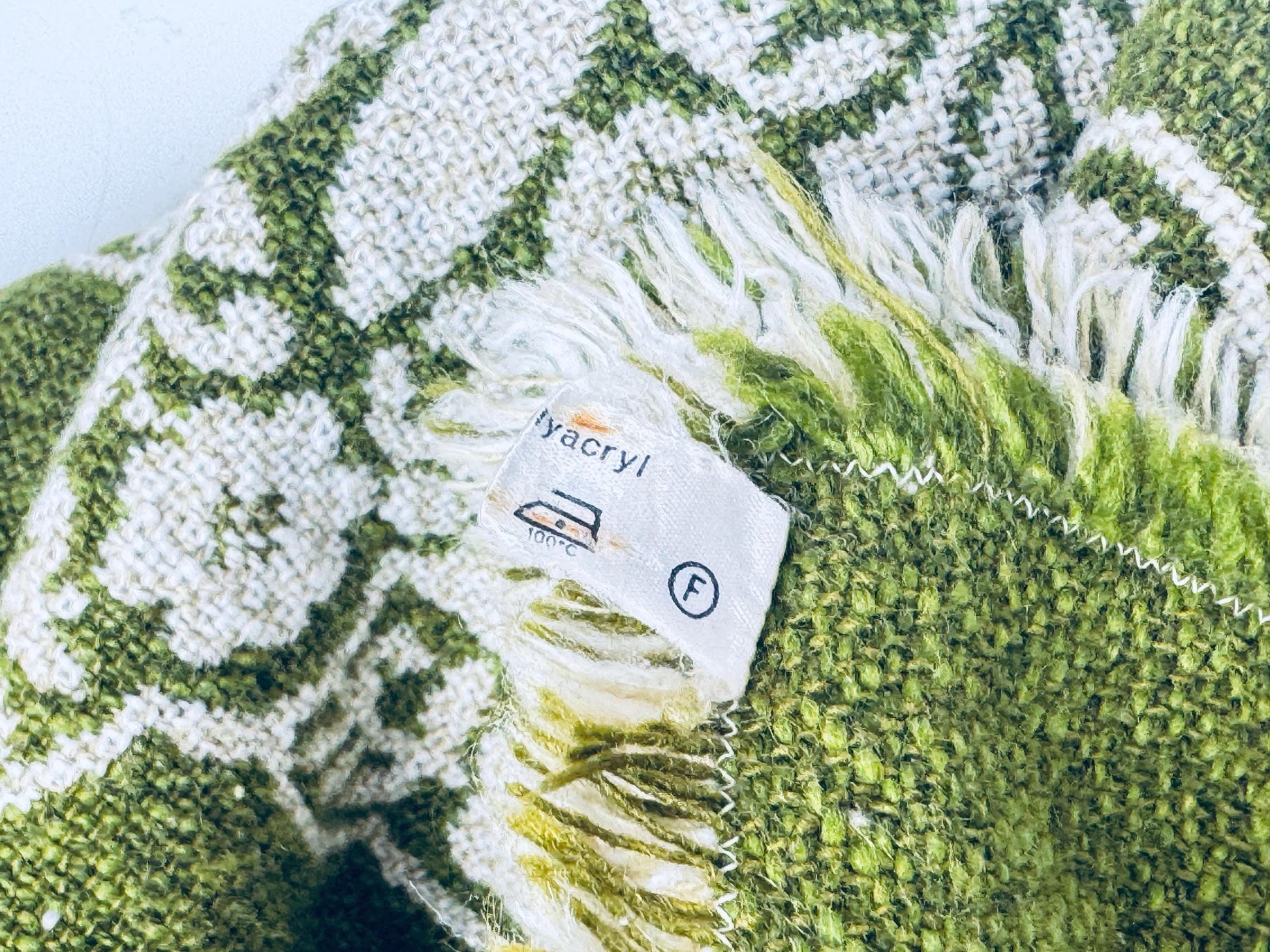 Label close-up showing acrylic fibre content and laundering care instructions