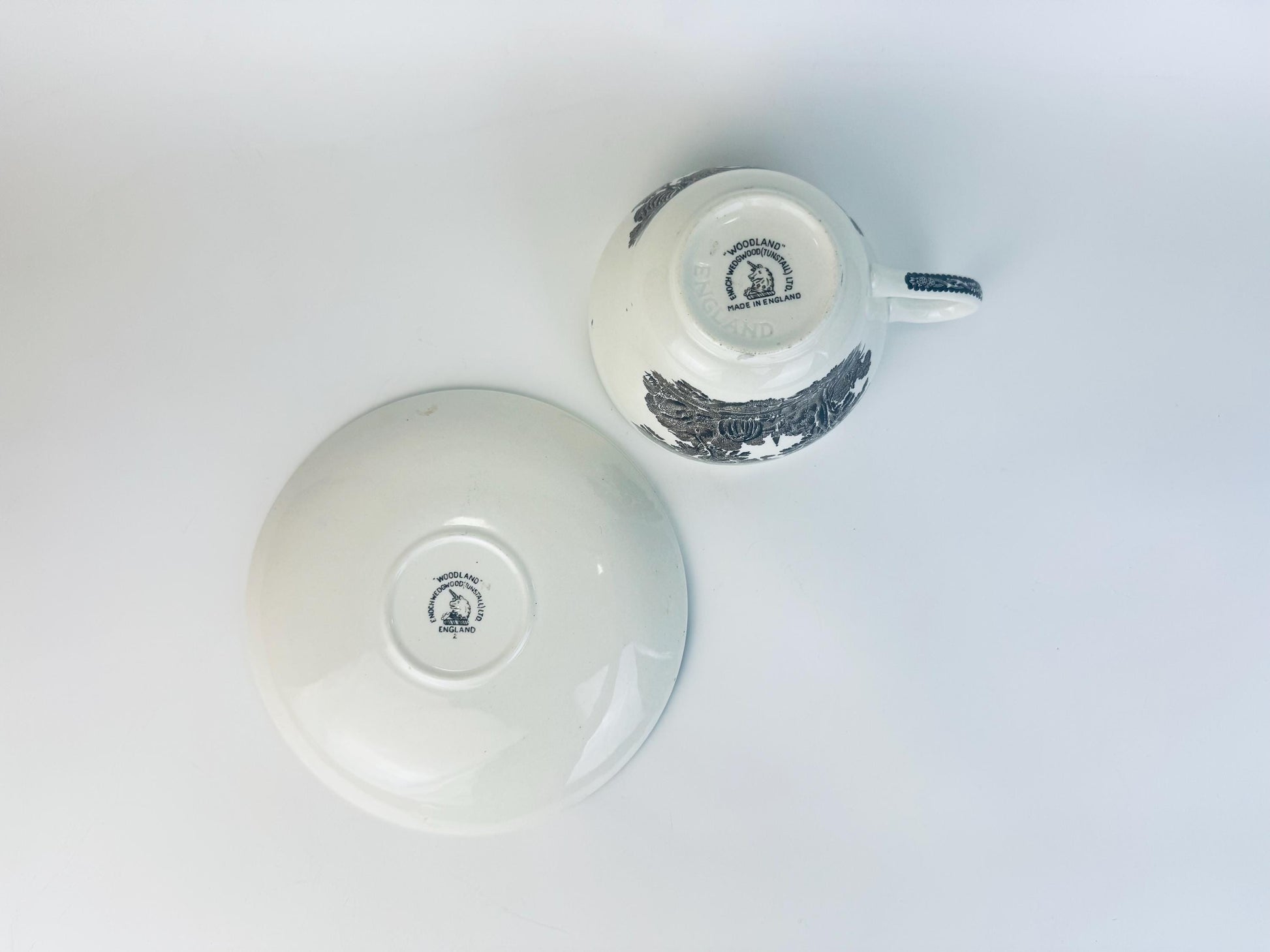 Underside of vintage Johnson Brothers Woodland teacup and saucer showing maker’s marks and “Made in England” backstamp