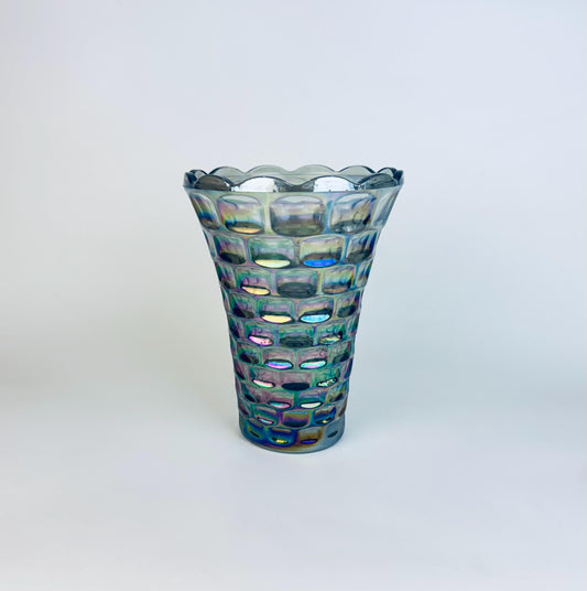 Decorative glass vase with a textured pattern on a white background