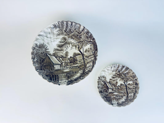 Pair of vintage English ironstone plates in Watermill brown transferware pattern, featuring rural countryside mill scene with trees and cottages.