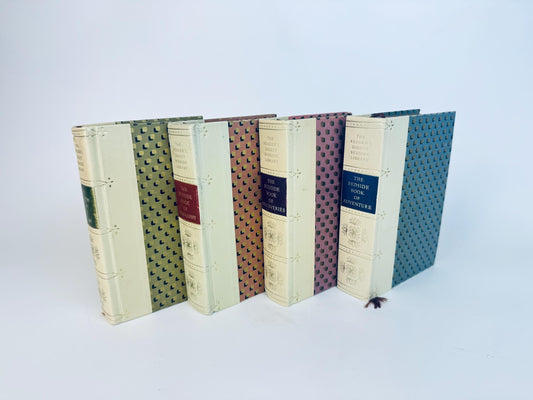 Set of four vintage 1960s Reader’s Digest Bedside Book Library hardcovers with cream leatherette spines and patterned covers in green, red, brown, and blue. Decorative collectible books sold separately, ideal for display or reading.