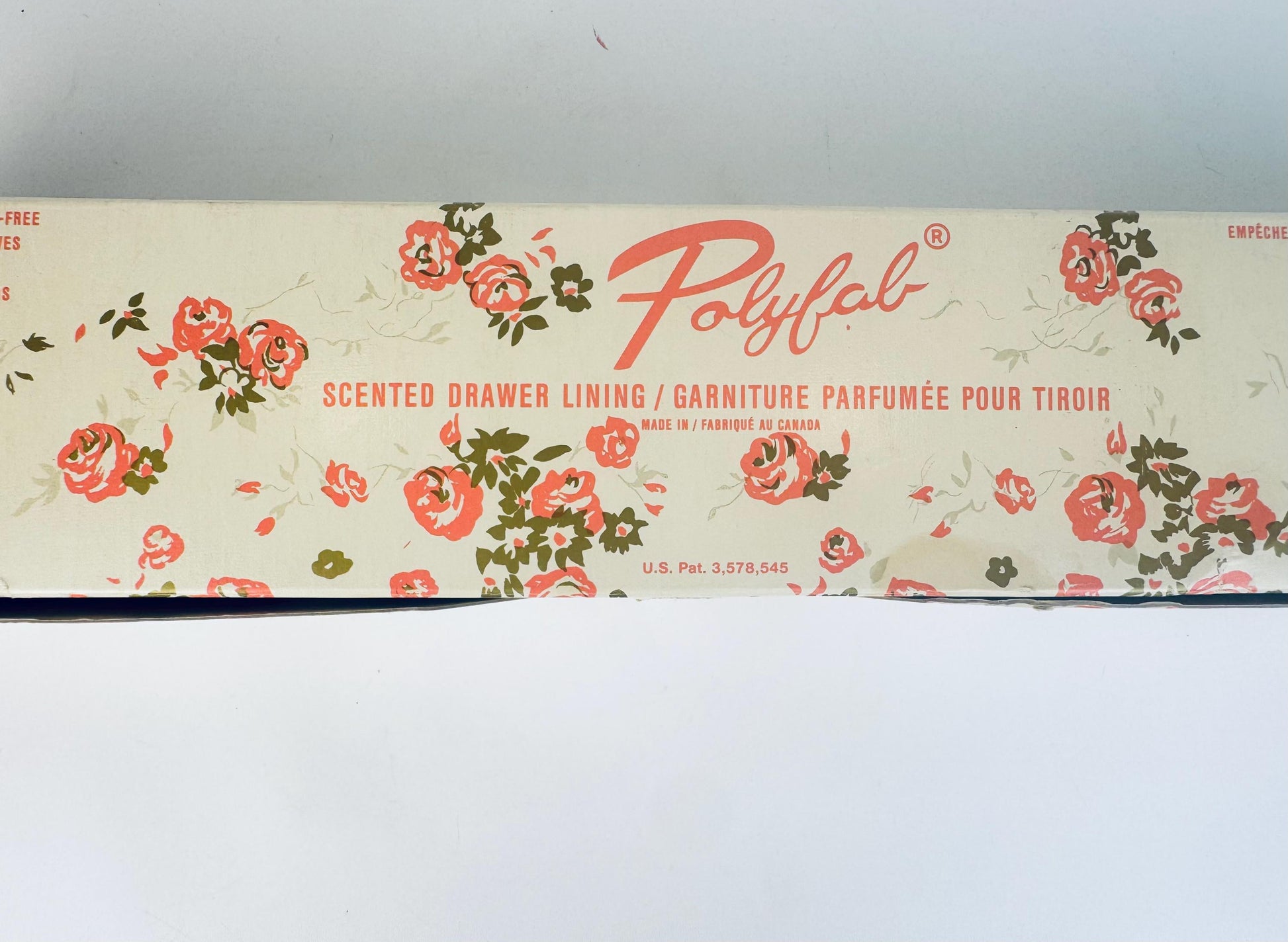 Floral-patterned scented drawer lining with 'Polyfab' branding on a white background