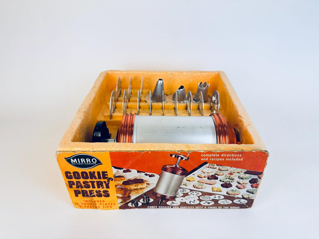 Vintage Mirro Cookie Pastry Press set in its packaging on a white background