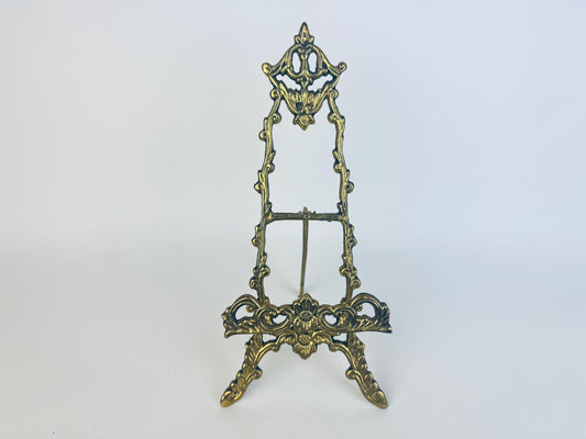 Decorative brass stand on a white background