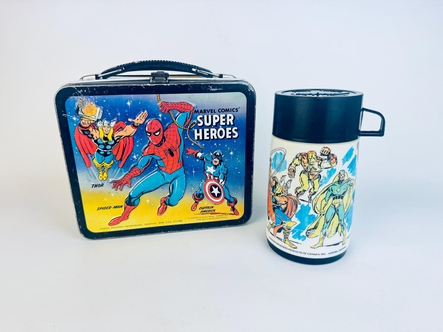 Marvel Super Heroes lunch box and thermos set on a white background