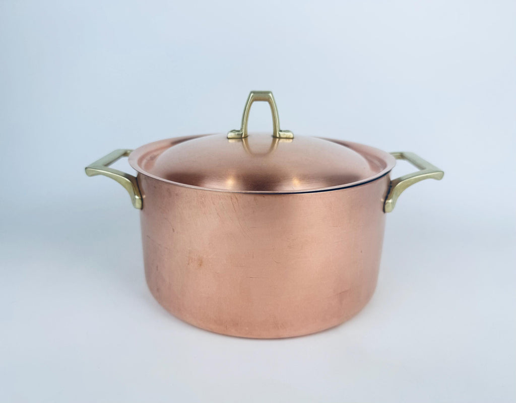 Vintage 1970s Paul Revere Limited Edition copper stock pot with brass lid handle and stainless-steel interior. 