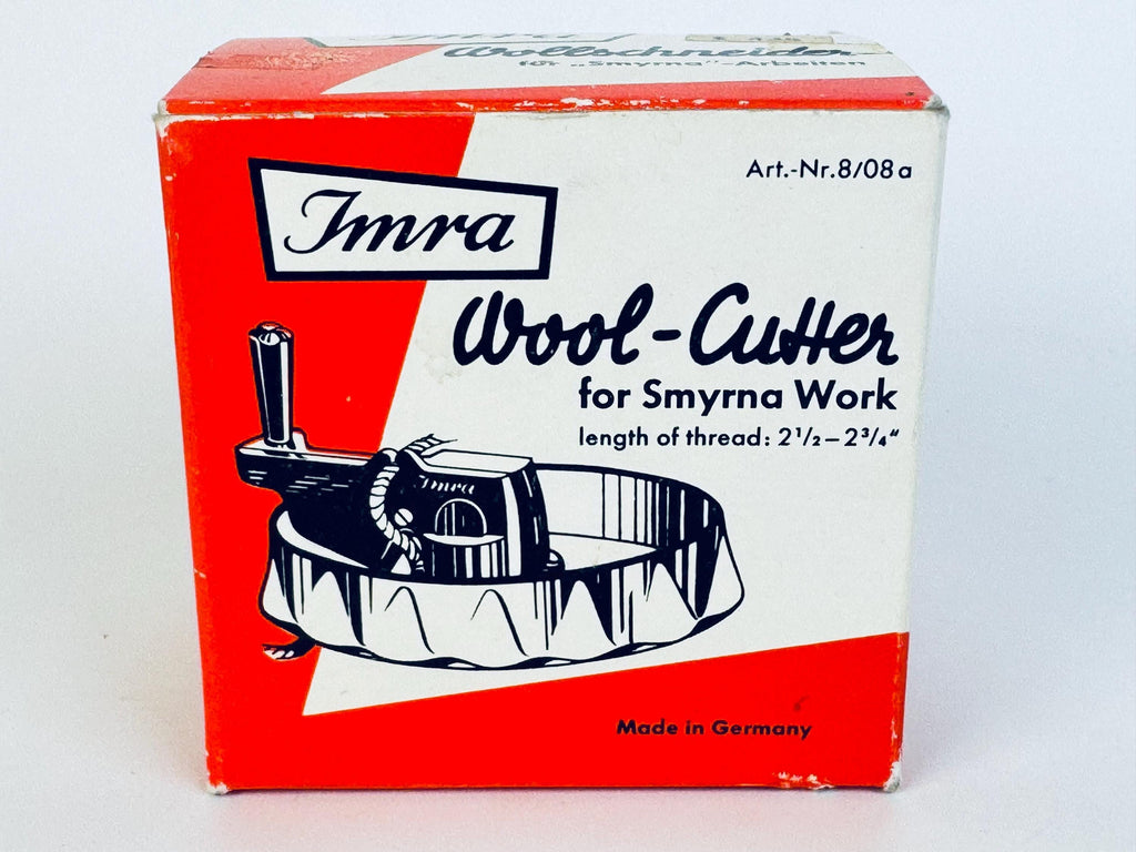 Front view of a vintage Imra Wool-Cutter box from the 1950s, featuring bold red and white mid-century graphics, black illustrated cutter artwork, and “Made in Germany” printed at the bottom.