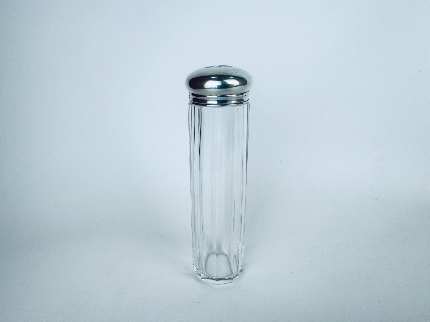 Hallmarked sterling silver lid with A & J Zimmerman maker’s mark and Birmingham Anchor on clear cut-crystal tall fluted vanity jar.