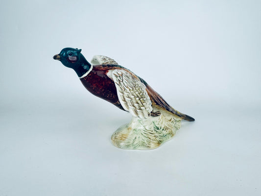 Vintage Beswick ceramic flying pheasant figurine with outstretched wings in multicolour glaze. 
