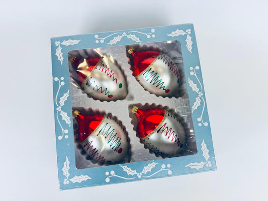 Boxed set of four vintage hand-blown red and silver glass Christmas ornaments in original packaging.