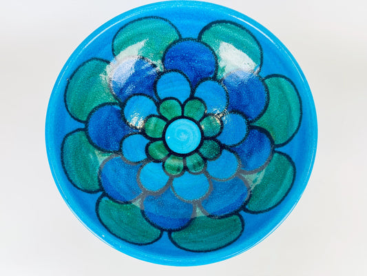 Vintage 1970s Italian Bellini ceramic bowl in turquoise and cobalt with hand-painted floral rosette design.